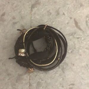 Cute multi bracelet black & gold with charms